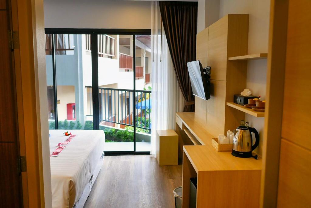 Postel nebo postele na pokoji v ubytování Baan Yuree Resort & Spa - SHA Plus