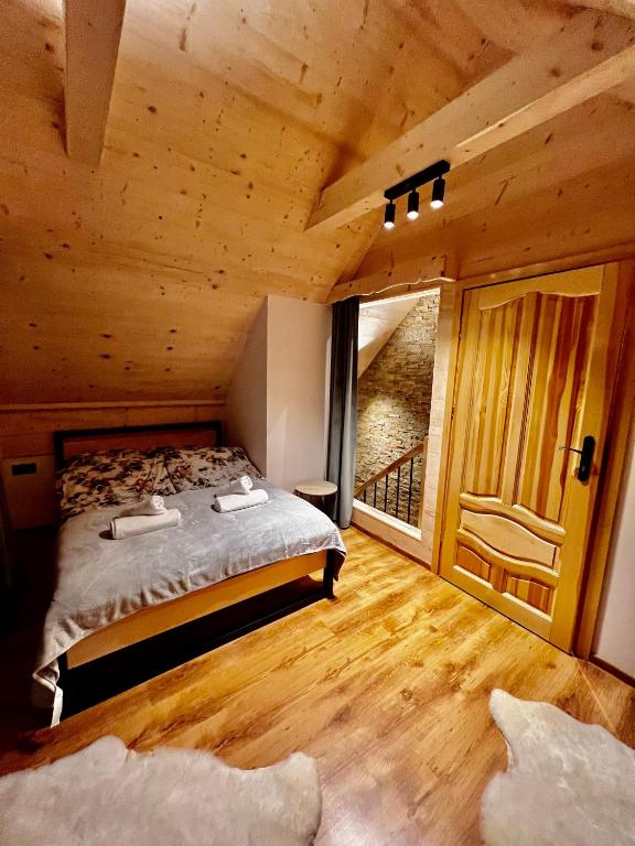 Postel nebo postele na pokoji v ubytování Tatra Village