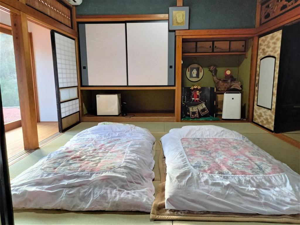 Postel nebo postele na pokoji v ubytování Farm Stay Ichirobee