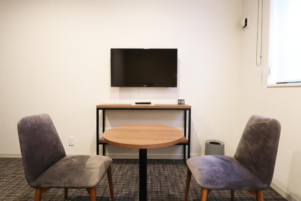 TV a/nebo společenská místnost v ubytování M's Hotel Nijojo Oike