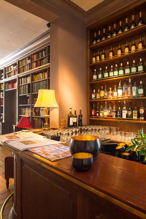 a bar with a bowl on a wooden counter at Monbijou Hotel in Berlin