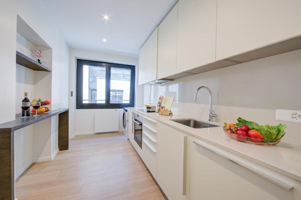 Kuchyň nebo kuchyňský kout v ubytování Boutique Apartments