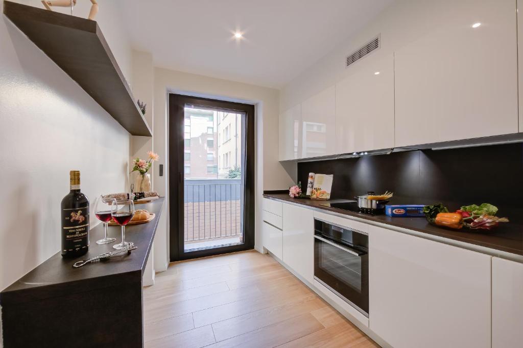 Kuchyň nebo kuchyňský kout v ubytování Boutique Apartments