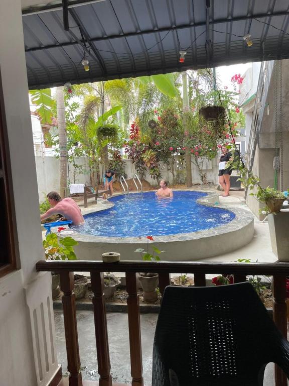 a group of people in a swimming pool at Yolanda Villa Negombo in Negombo