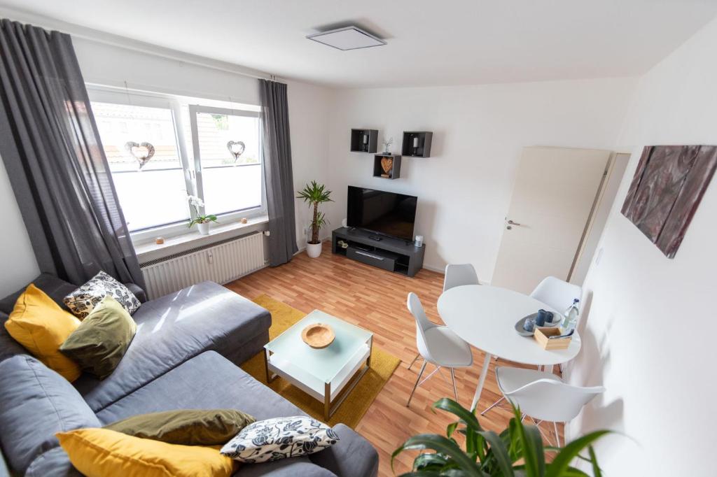 a living room with a couch and a table at Ferienwohnung Martin 3 und 4 in Bad Harzburg