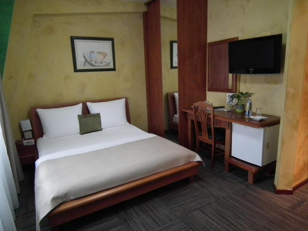 Postel nebo postele na pokoji v ubytování Hotel Kerber