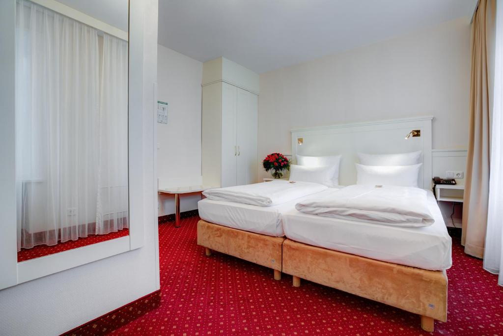 Cama o camas de una habitación en Hotel Fürst Bismarck