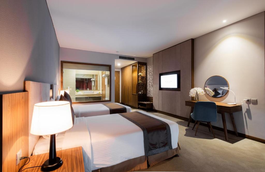 Giường trong phòng chung tại Muong Thanh Luxury Vien Trieu Nha Trang