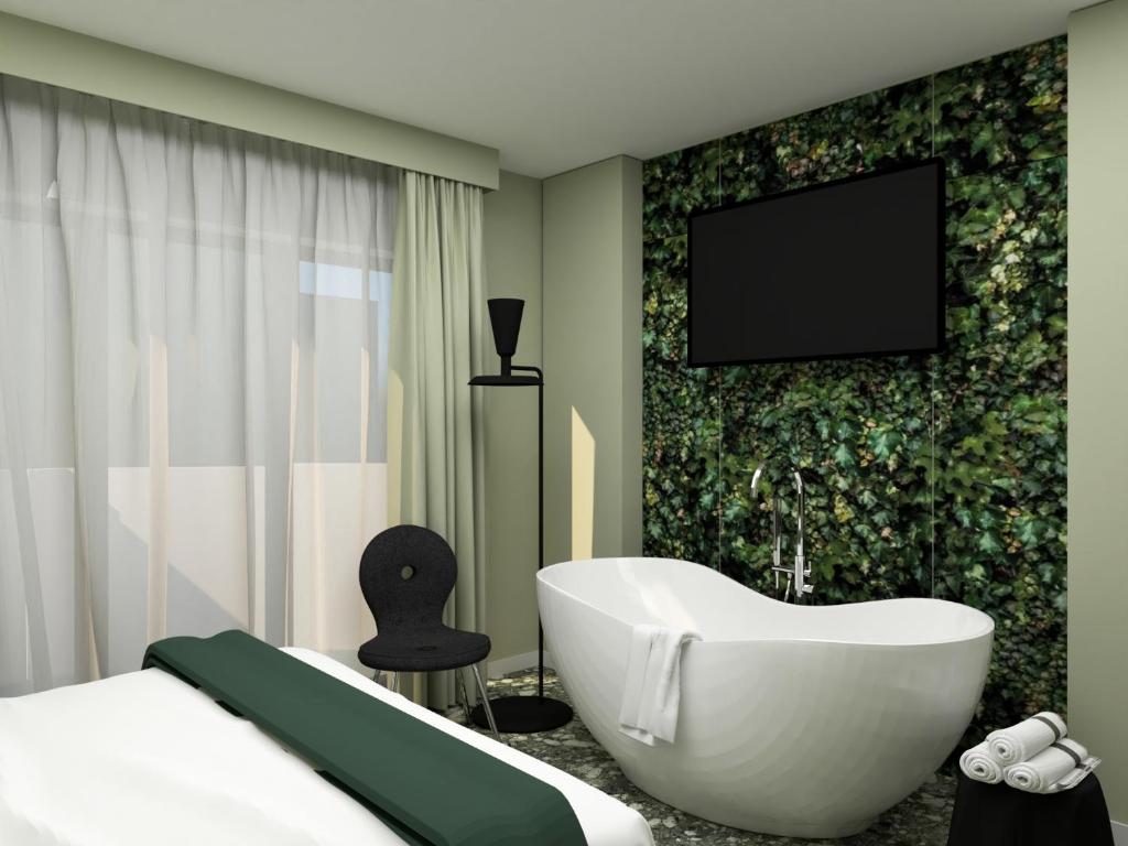 Postel nebo postele na pokoji v ubytování Parc Hotel Flora S