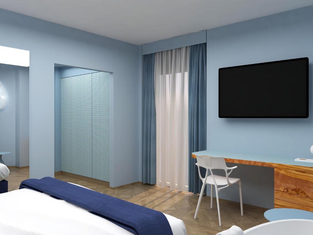 TV a/nebo společenská místnost v ubytování Parc Hotel Flora S