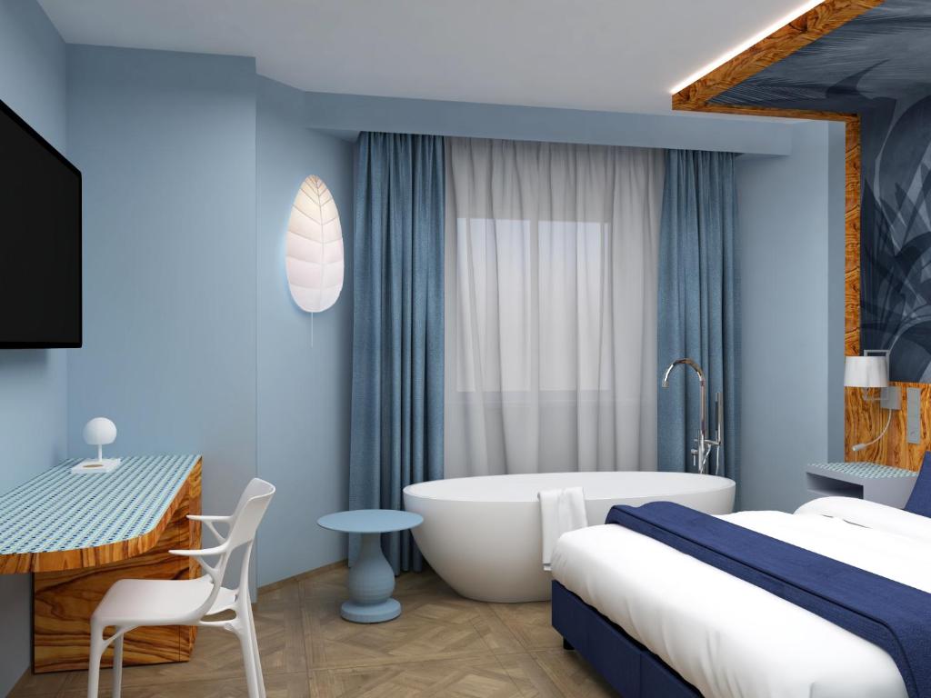 Postel nebo postele na pokoji v ubytování Parc Hotel Flora S