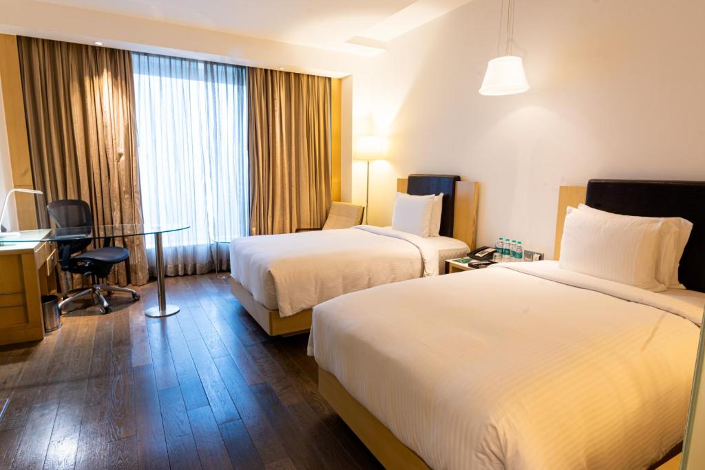 Postel nebo postele na pokoji v ubytování Crowne Plaza Greater Noida by IHG