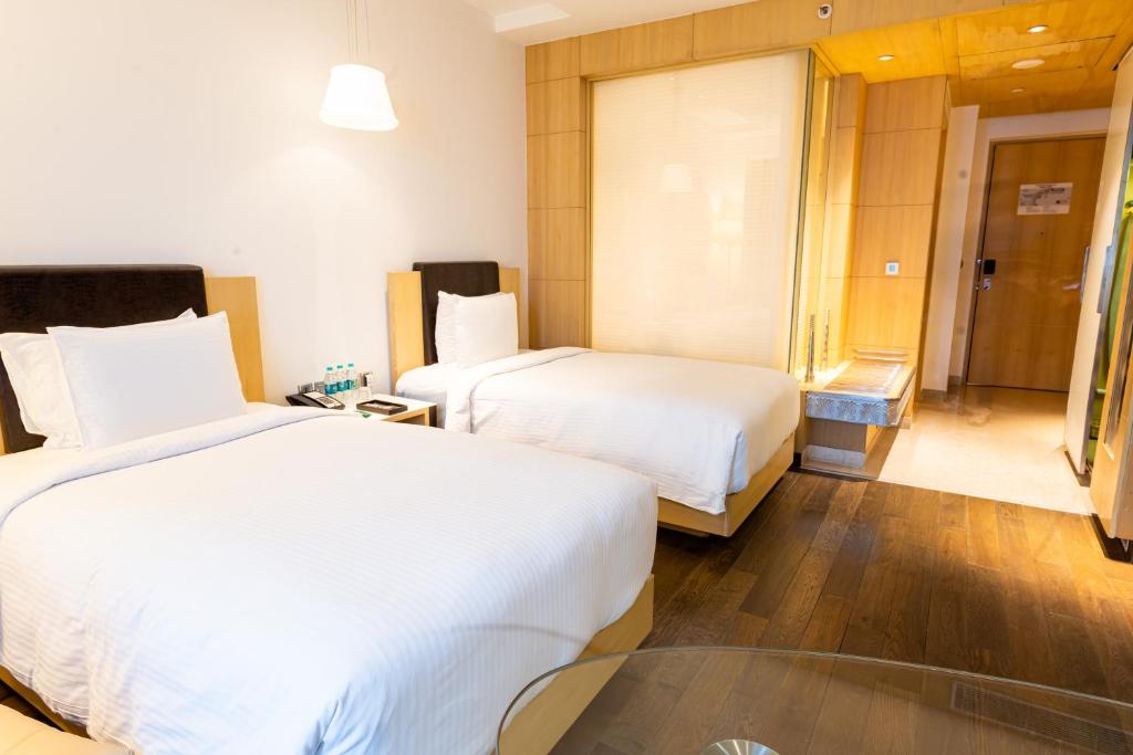 Postel nebo postele na pokoji v ubytování Crowne Plaza Greater Noida by IHG
