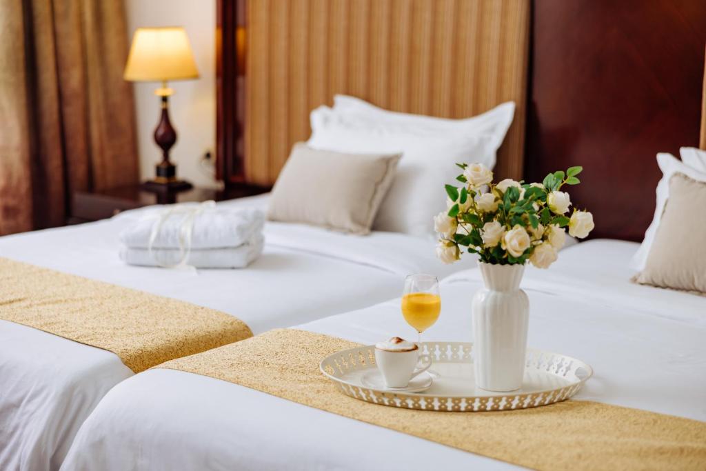 Letto o letti in una camera di Garni Hotel Planeta Inn
