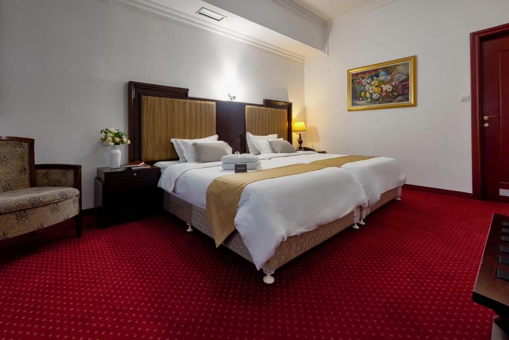 Letto o letti in una camera di Garni Hotel Planeta Inn