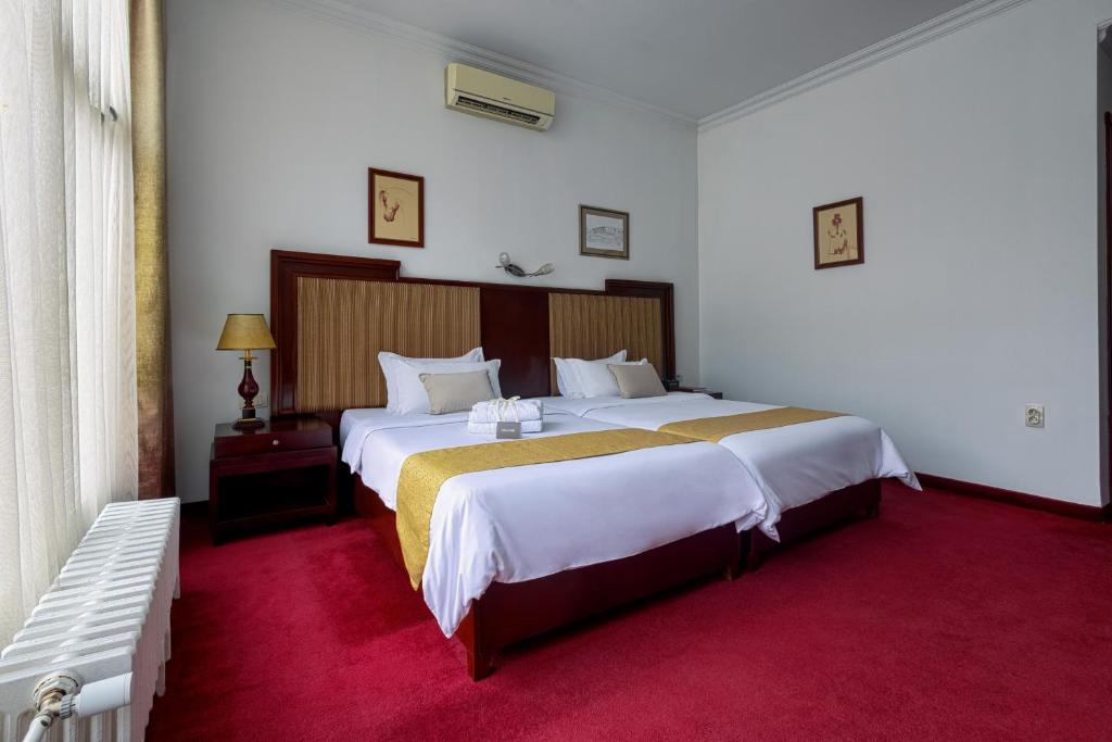 Letto o letti in una camera di Garni Hotel Planeta Inn