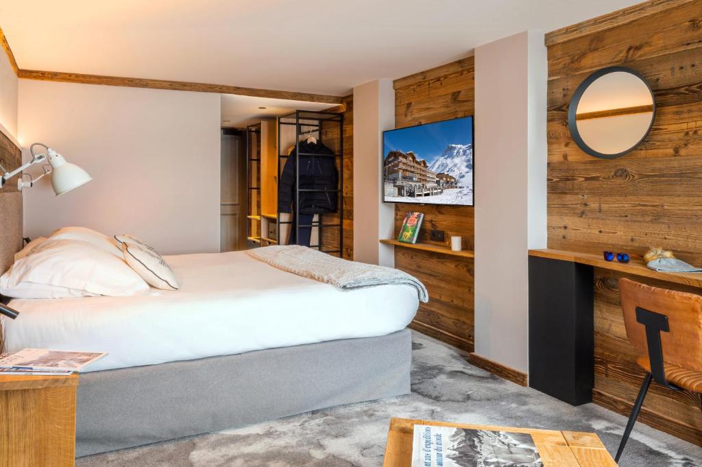 Postel nebo postele na pokoji v ubytování Hôtel Le Levanna by Les Etincelles