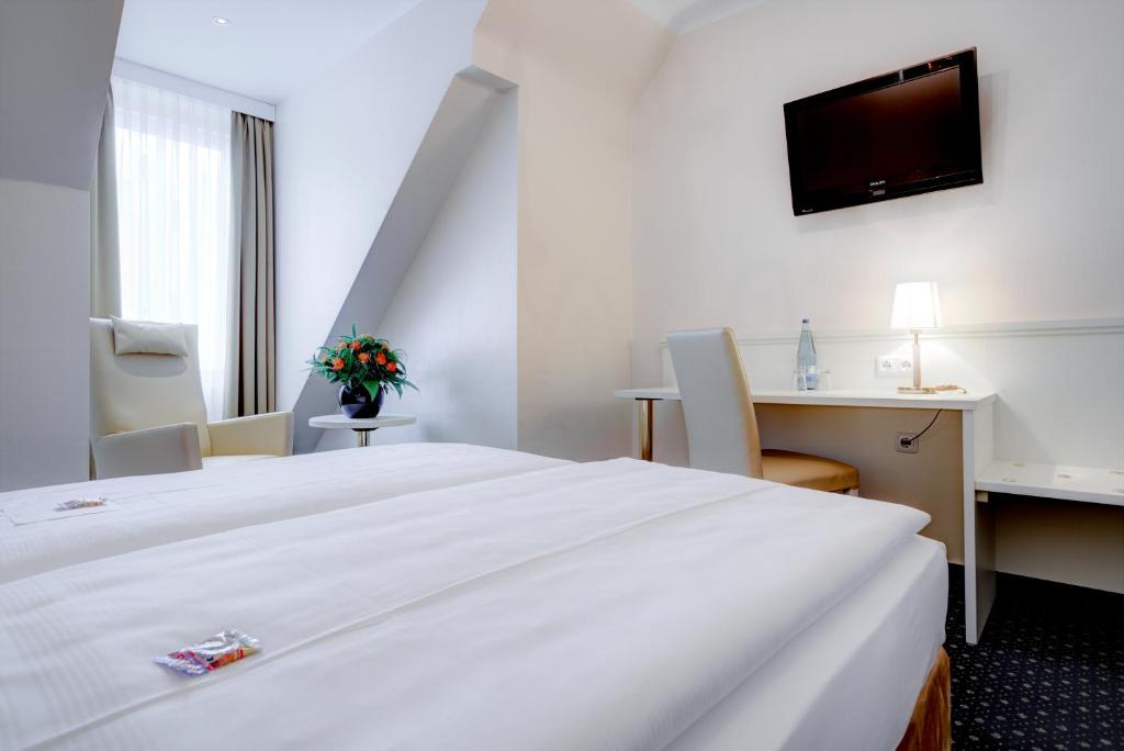 Cama o camas de una habitación en Hotel Fürst Bismarck