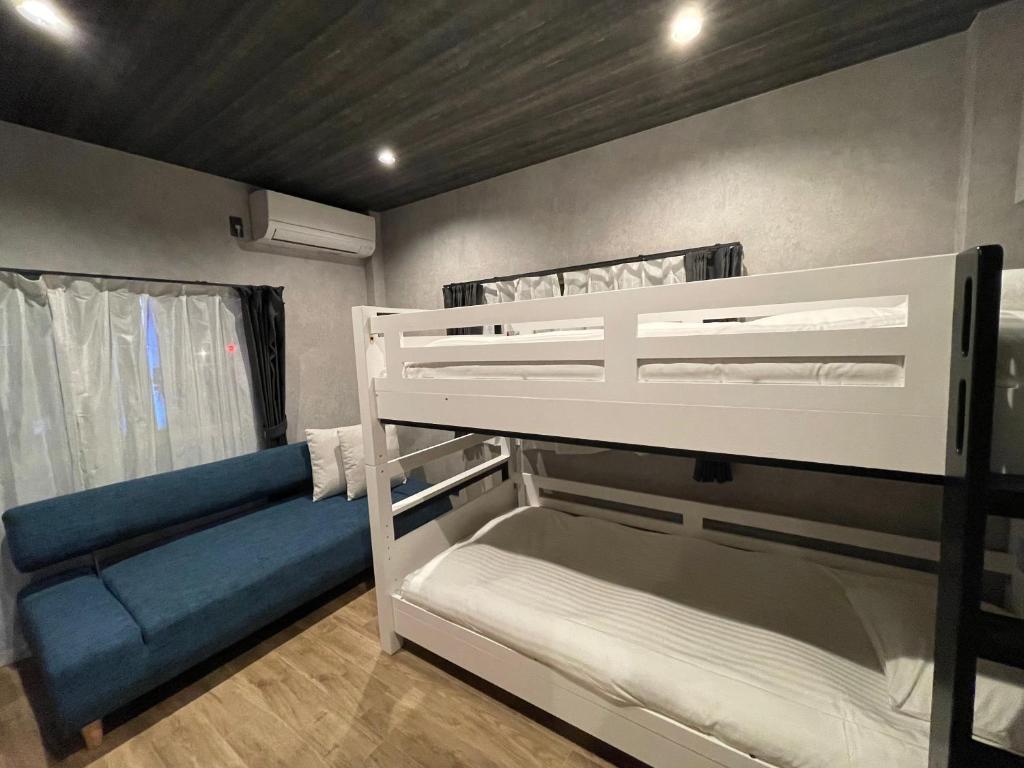 Postel nebo postele na pokoji v ubytování TOCORO. Mt.Fuji Station HOSTEL Kawaguchiko