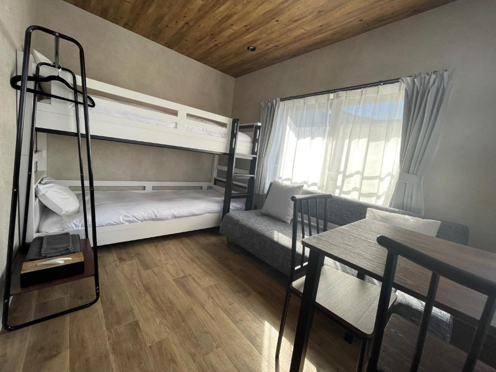 Postel nebo postele na pokoji v ubytování TOCORO. Mt.Fuji Station HOSTEL Kawaguchiko
