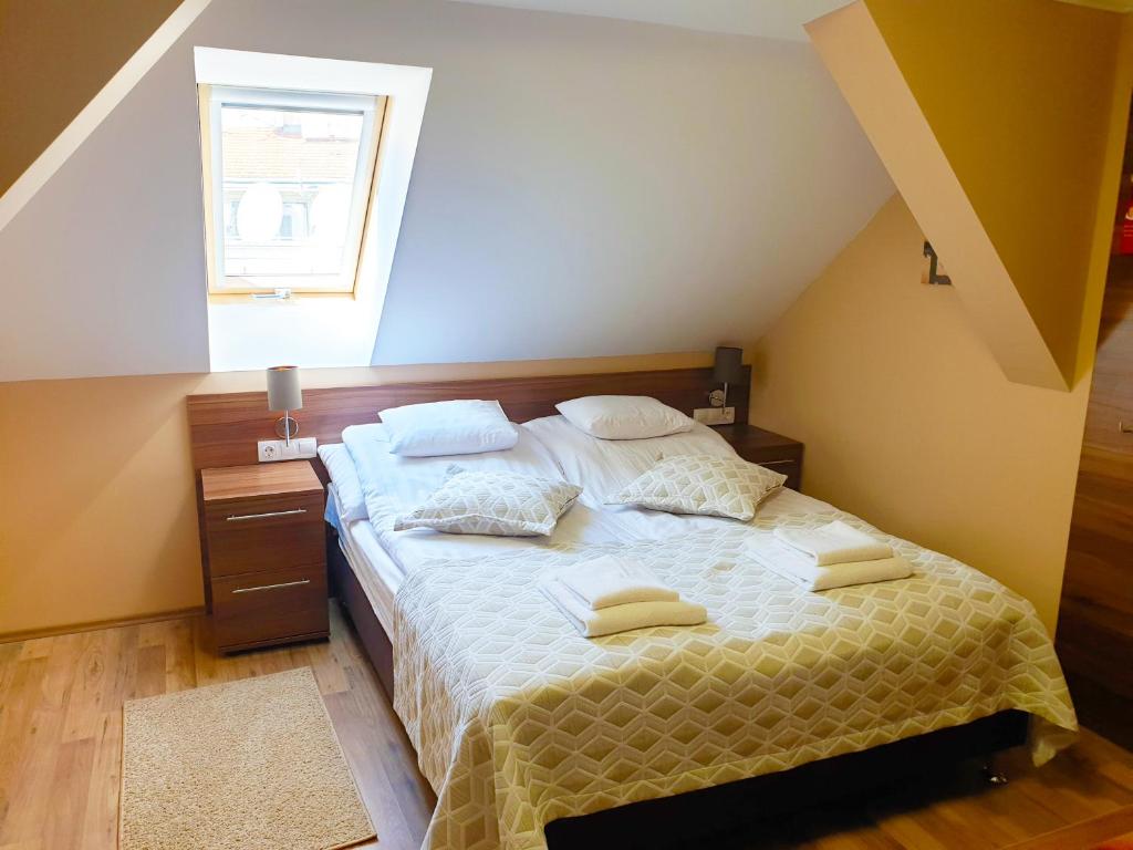 Postel nebo postele na pokoji v ubytování Forum Hotel