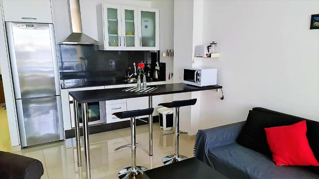 Kuchyňa alebo kuchynka v ubytovaní Yumbo Holiday Apartment - Tanife ROOS