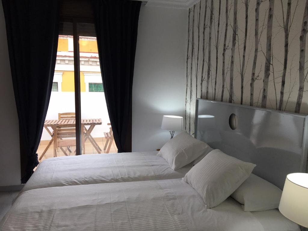 Postel nebo postele na pokoji v ubytování Correduria Premium Apartments