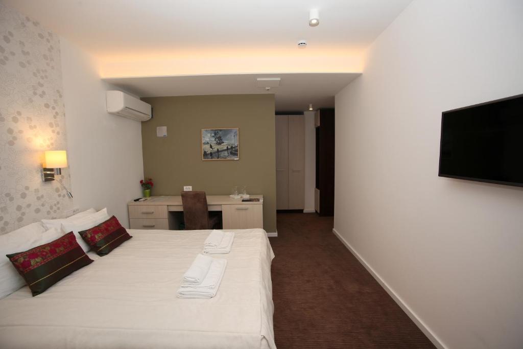 Postel nebo postele na pokoji v ubytování Konačište Grad B&B