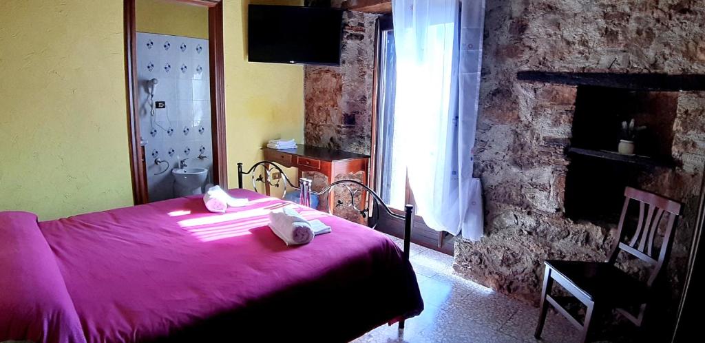 Postel nebo postele na pokoji v ubytování Il Castello