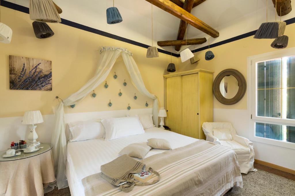 Postel nebo postele na pokoji v ubytování Hotel Villa Stella