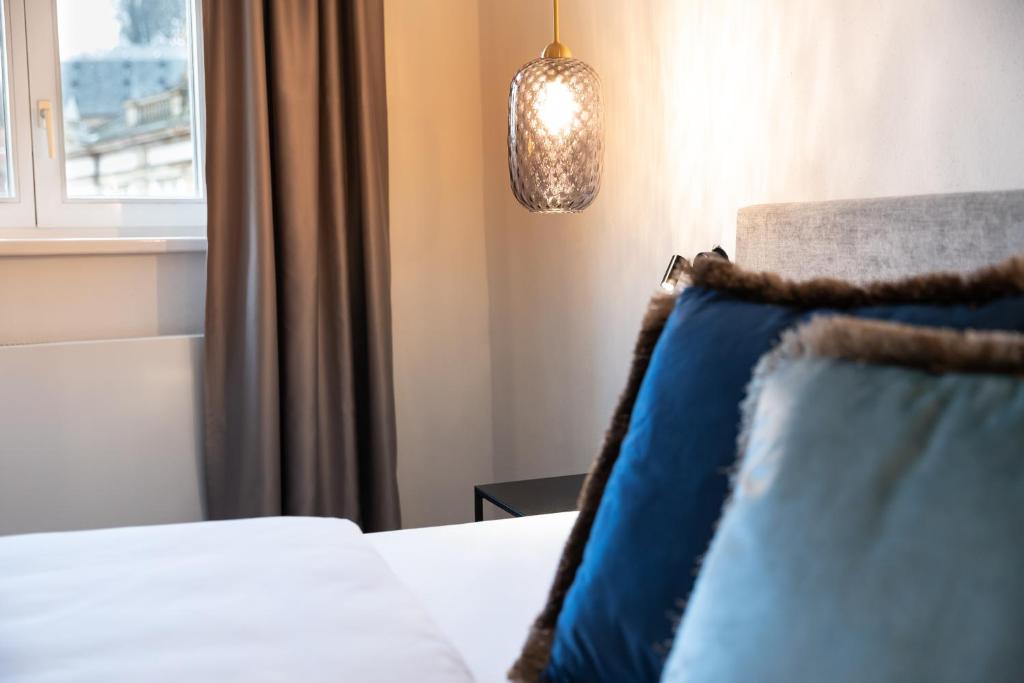 Postel nebo postele na pokoji v ubytování Hotel Weißes Ross