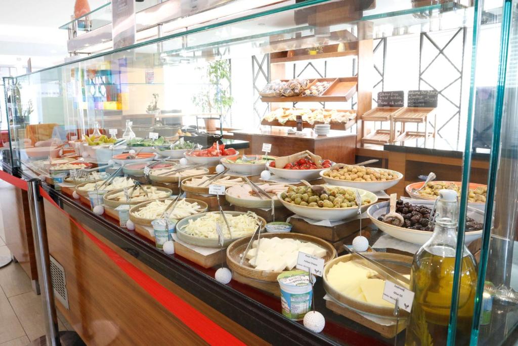 a buffet with many different types of food on display at Park Inn by Radisson Istanbul Asia Kavacik in Istanbul