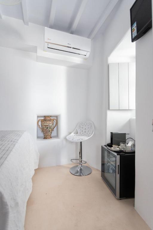 Łóżko lub łóżka w pokoju w obiekcie aníko suites Chora