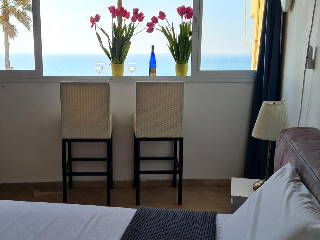 Postel nebo postele na pokoji v ubytování Magic on the sea-suites with a private jacuzzi and a private sea view
