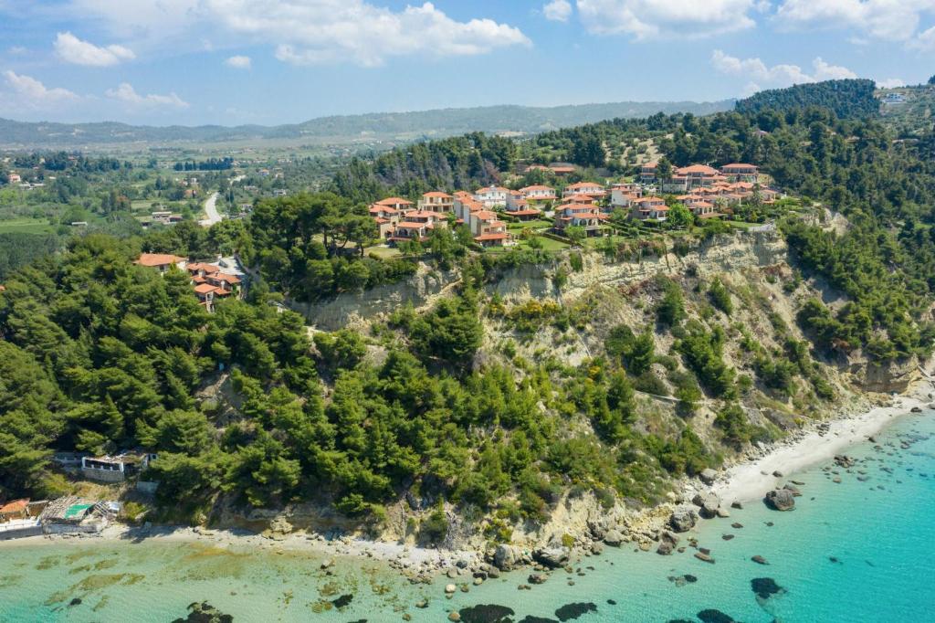 an aerial view of a resort on a rocky island at Possidi Villas in Possidi