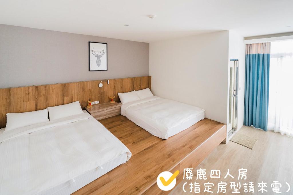 Postel nebo postele na pokoji v ubytování Pomelo Homestay