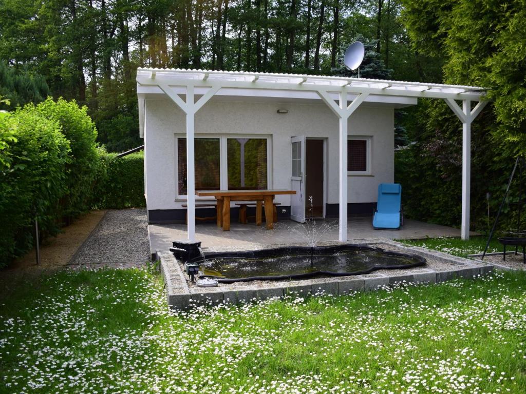 a small shed with a cat sitting in front of it at Bungalow summer house, Parchim in Parchim