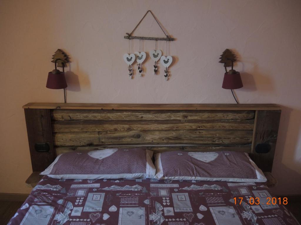 Postel nebo postele na pokoji v ubytování La Ferme du Grand Paradis
