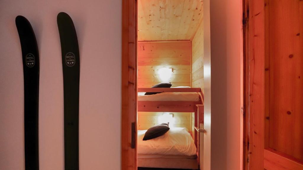 Postel nebo postele na pokoji v ubytování Chalet Hôtel des 2 Gares & SPA