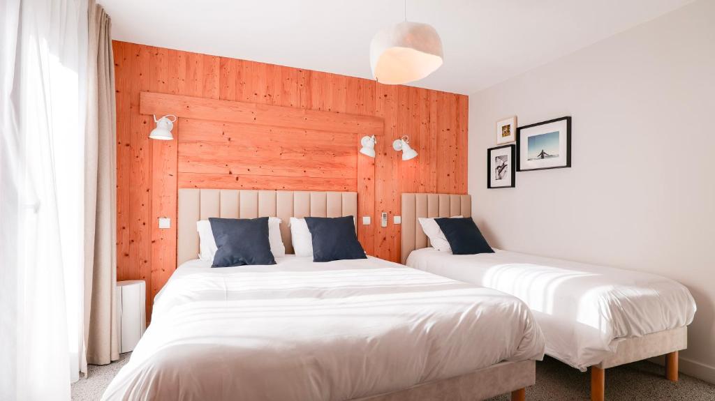 Postel nebo postele na pokoji v ubytování Chalet Hôtel des 2 Gares & SPA
