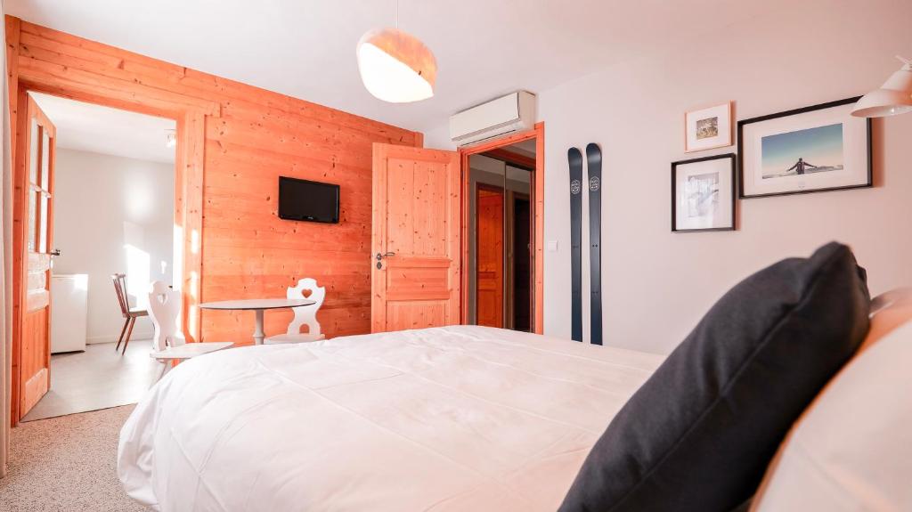 Postel nebo postele na pokoji v ubytování Chalet Hôtel des 2 Gares & SPA