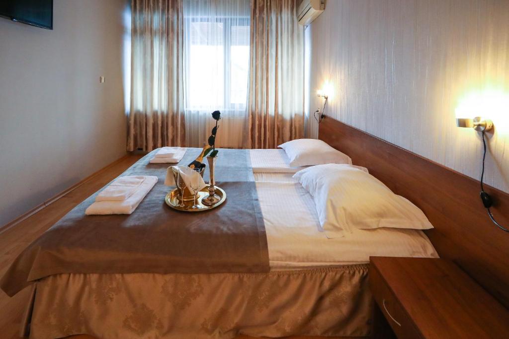 Postel nebo postele na pokoji v ubytování Complex Baroto