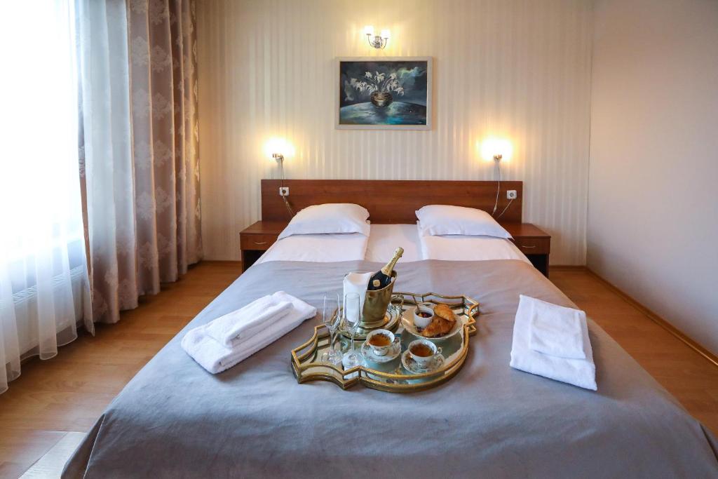 Postel nebo postele na pokoji v ubytování Complex Baroto