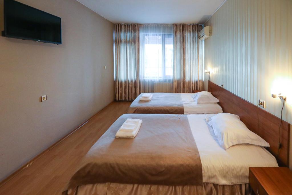 Postel nebo postele na pokoji v ubytování Complex Baroto