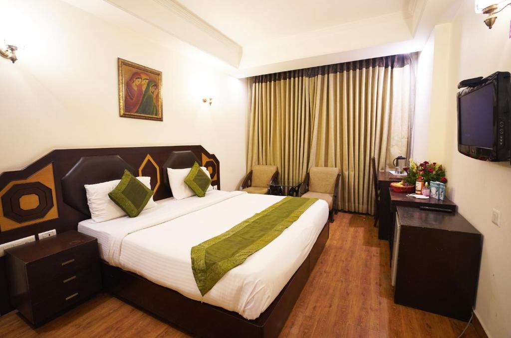Postel nebo postele na pokoji v ubytování Airport Hotel Grand by Fantasia