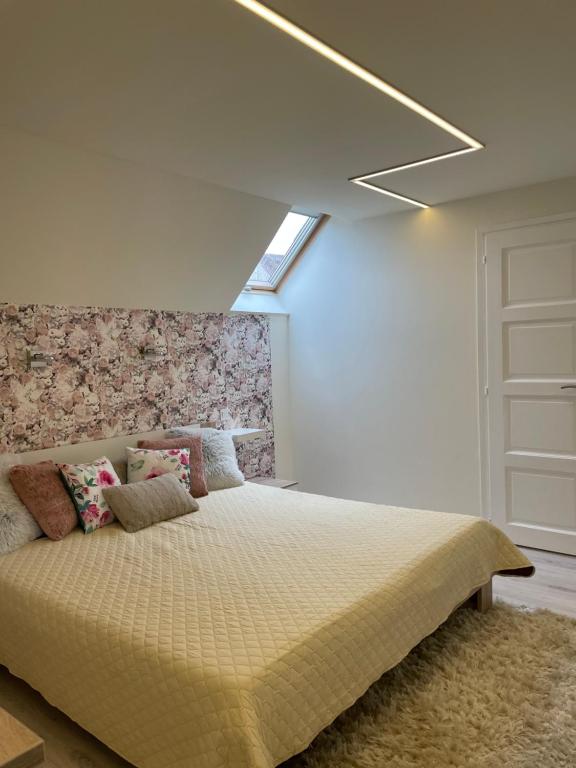 Posteľ alebo postele v izbe v ubytovaní Zen Apartman