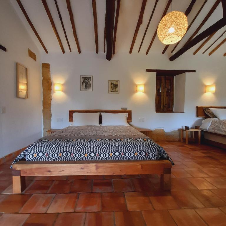 Postel nebo postele na pokoji v ubytování Casa Alamanda B&B