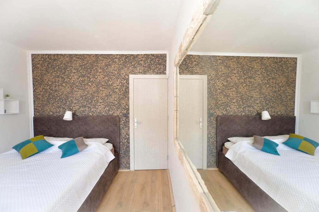 Postel nebo postele na pokoji v ubytování Vila Andrea