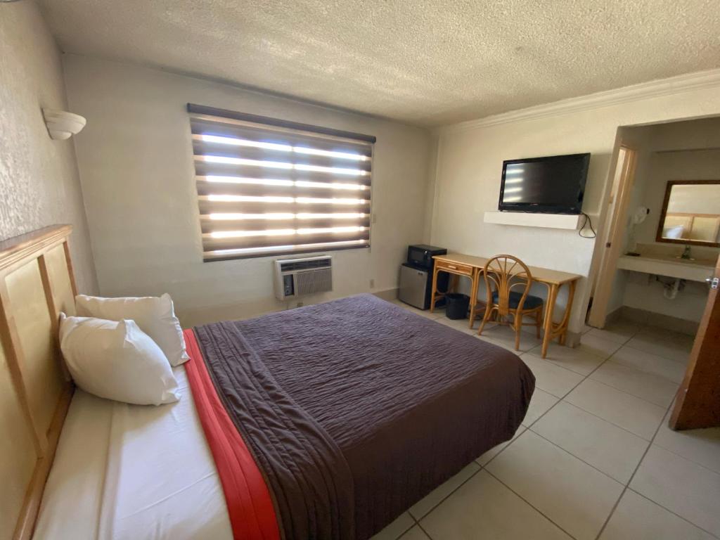 Postel nebo postele na pokoji v ubytování Hotel Paris