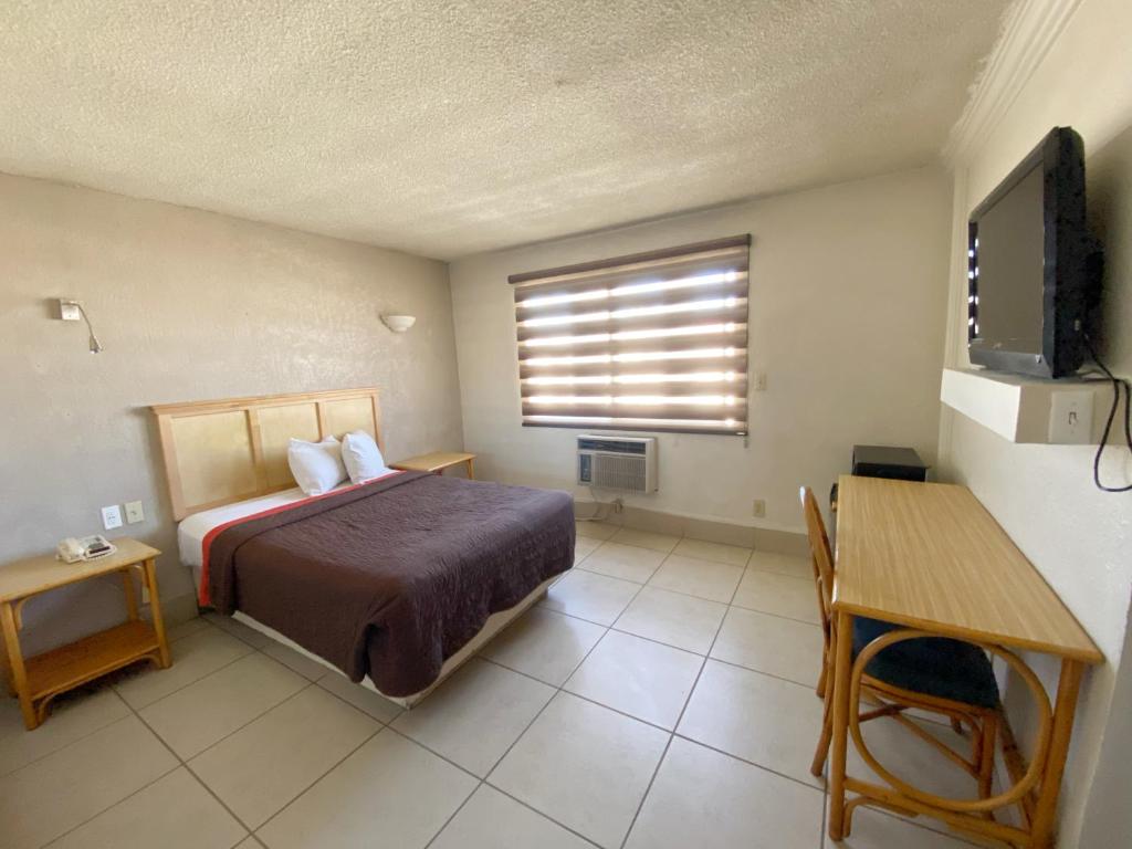 Postel nebo postele na pokoji v ubytování Hotel Paris